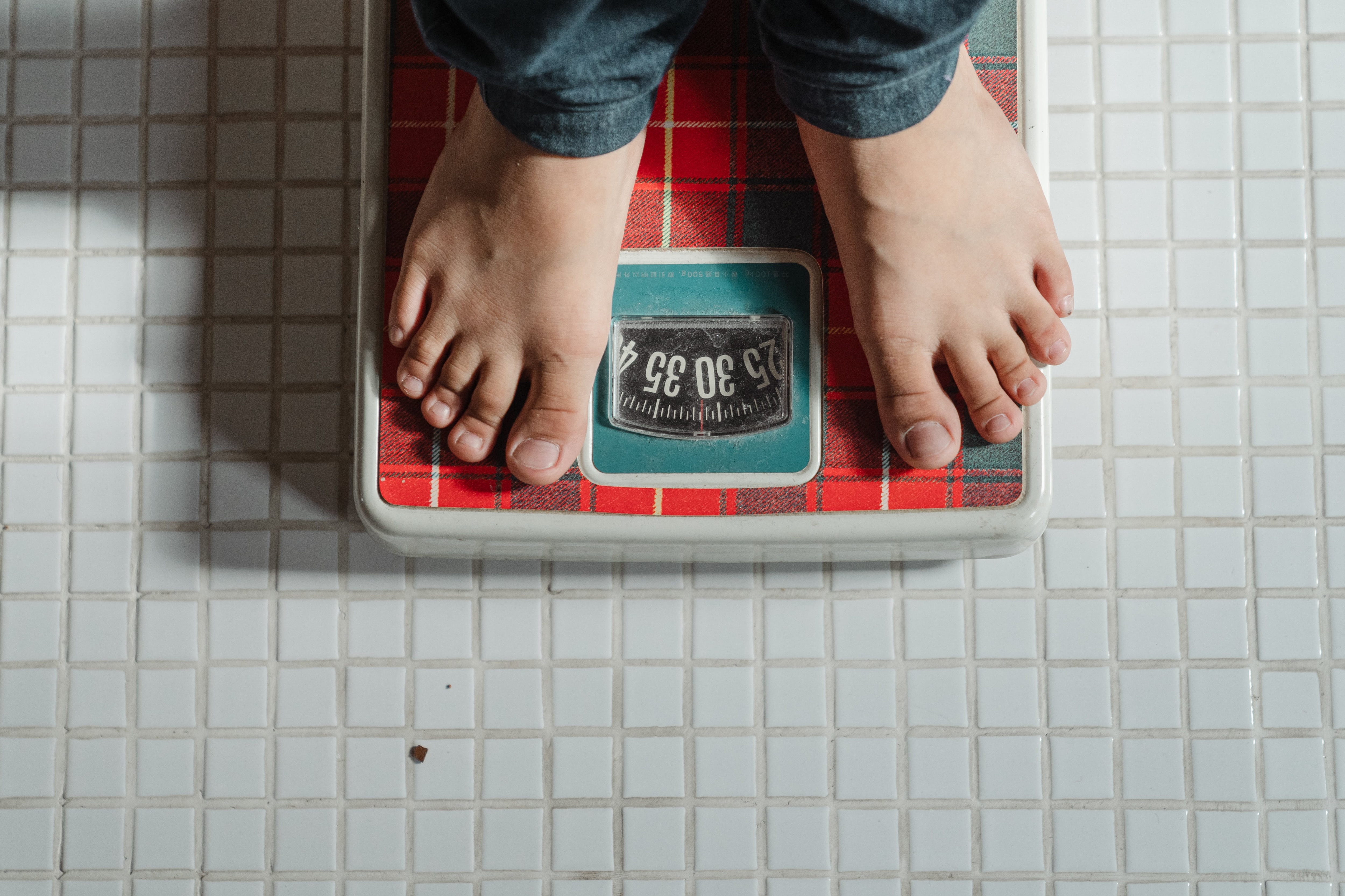 Person standing on bathroom scale